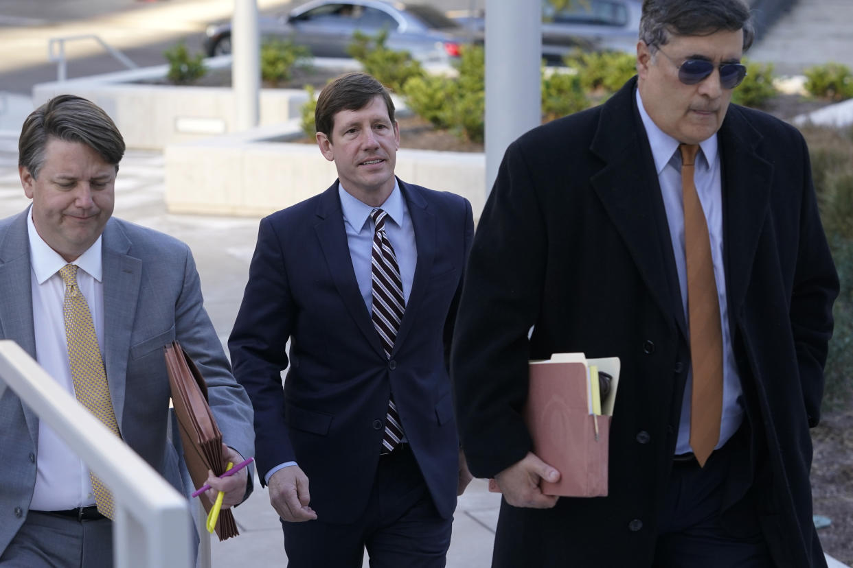 Former Republican state Sen. Brian Kelsey, center, arrives at federal court Tuesday, Nov. 22, 2022, in Nashville, Tenn. Kelsey changed an earlier plea of not guilty to guilty Tuesday, on charges of violating federal campaign finance laws. (AP Photo/Mark Humphrey)