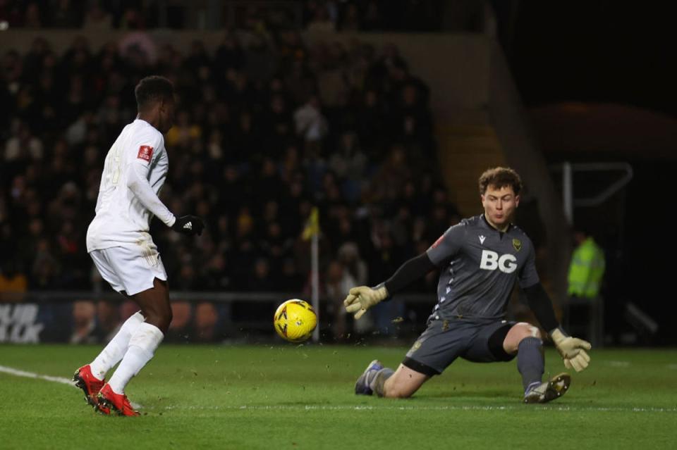 Nketiah dinks past McGinty to add Arsenal’s third (Getty Images)