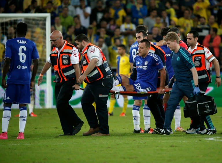 Chelsea's John Terry (C) is carried off the pitch on a stretcher during the UEFA Champions League, group G, match against Maccabi Tel Aviv on November 24, 2015