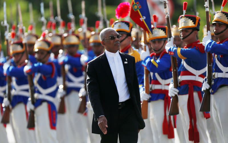 FILE PHOTO: Guyana's President David Arthur Granger review an honour guard during Mercosur trade bloc annual summit in Brasilia