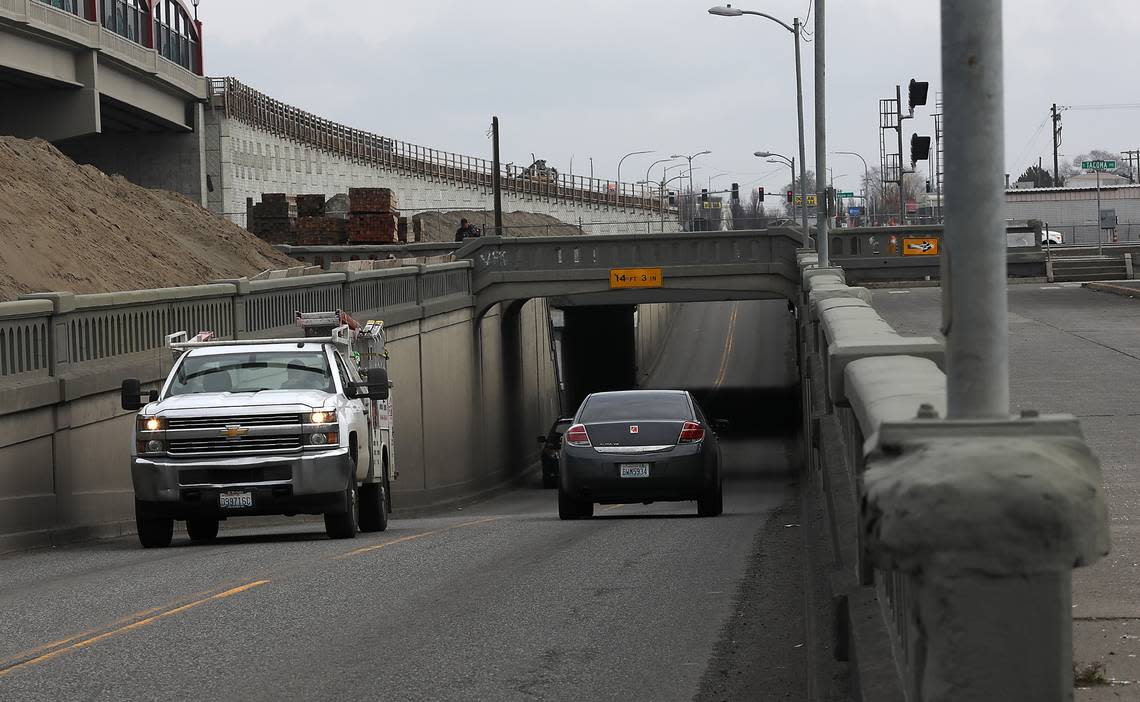 Traffic recently drives through the Lewis Street underpass that was built in 1937 below the BNSF railroad tracks.