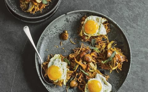 Jerusalem-artichoke fritters with wild mushrooms and fried egg - Credit: Haarala Hamilton