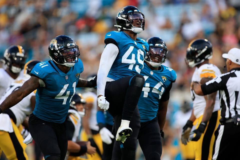Jacksonville Jaguars defensive end Arden Key #49 reacts to recording a sack as teammates linebacker Josh Allen #41 and linebacker Travon Walker #44 celebrate too during the first quarter of an NFL preseason game Saturday, Aug. 20, 2022 at TIAA Bank Field in Jacksonville. [Corey Perrine/Florida Times-Union]