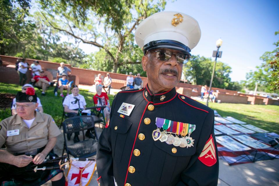 Marine veteran Lewis Alston listens during the Memorial Day Remembrance Ceremony at the Ocala-Marion County Veterans Memorial Park in Ocala, Florida, on Monday, May 30, 2022. Veterans and the community gathered to remember the fallen.
