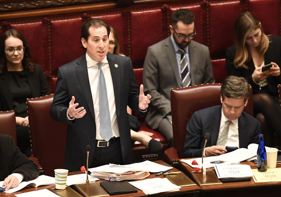 Sen. Todd Kaminsky, D-Rockville Centre, speaks as Senate members debate budget bills in the Senate Chamber at the state Capitol Sunday, March, 31, 2019, in Albany, N.Y. (AP Photo/Hans Pennink)