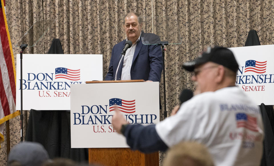 Former Massey CEO and West Virginia Republican Senatorial candidate, Don Blankenship, listens as supporter Doug Smith poses a question during a town hall to kick off his campaign in Logan, W.Va., Thursday, Jan. 18, 2018. The onetime coal businessman will face U.S. Rep. Evan Jenkins and West Virginia Attorney General Patrick Morrisey in the May 8 GOP primary. (AP Photo/Steve Helber)