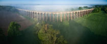 <p>Puffs of cloud hover over the Balcombe viaduct, the route from London to Brighton. </p>