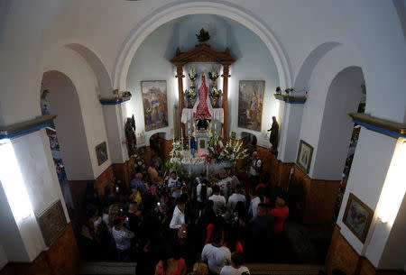 Roma people pray to the Virgin Mary in the chapel in Csatka, Hungary on September 9, 2017. REUTERS/Laszlo Balogh