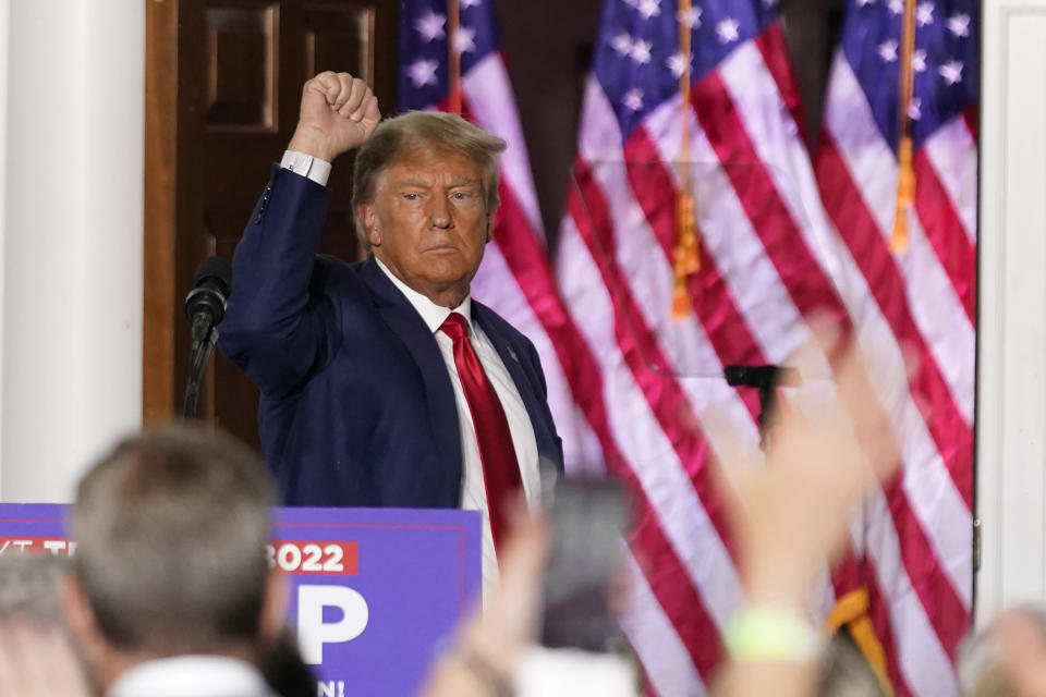 Former President Donald Trump with his fist raised in the air after speaking at Trump National Golf Club in Bedminster, N.J., on Tuesday.