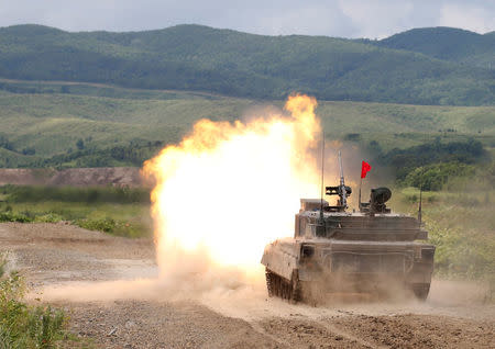 A Japan Ground Self Defense Force's Type 90 tank fires during their joint exercise, named Northern Viper 17, with U.S. Marine Corps at Hokudaien exercise area in Eniwa, on the northern island of Hokkaido, Japan, August 16, 2017. REUTERS/Toru Hanai