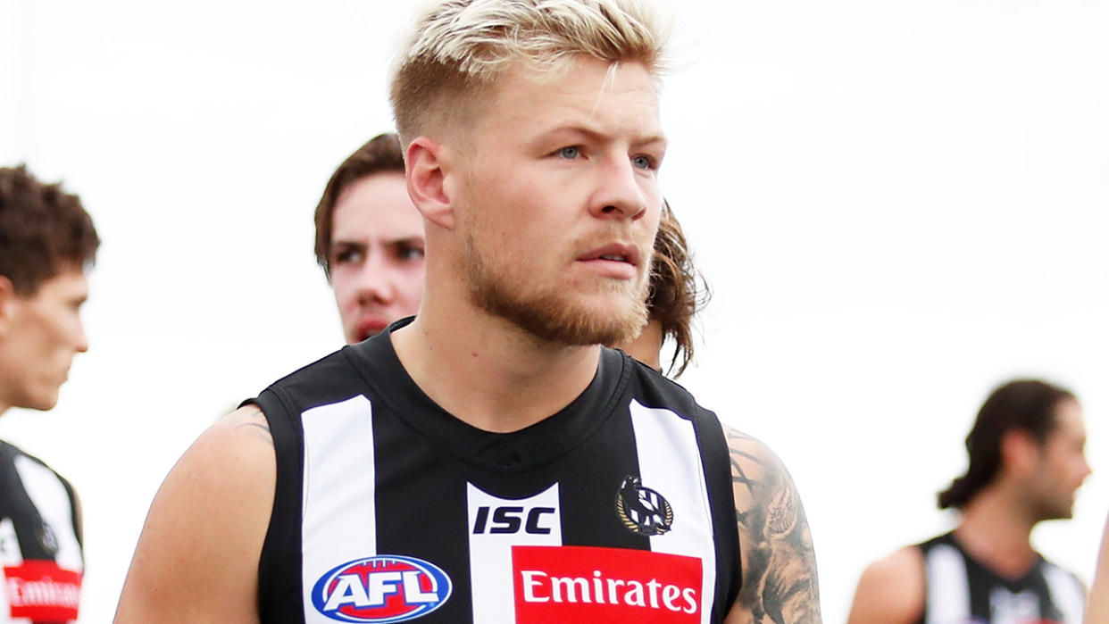 Collingwood's Jordan De Goey is pictured walking off the field after an AFL pre-season match.