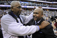 FILE - In this March 9, 2013, file photo, former Georgetown coach John Thompson Jr., left, congratulates his son Georgetown head coach John Thompson III, right, after the Hoya's 61-39 win over Syracuse in an NCAA college basketball game in Washington. John Thompson, the imposing Hall of Famer who turned Georgetown into a “Hoya Paranoia” powerhouse and became the first Black coach to lead a team to the NCAA men’s basketball championship, has died. He was 78 His death was announced in a family statement Monday., Aug. 31, 2020. No details were disclosed. (AP Photo/Nick Wass, File)