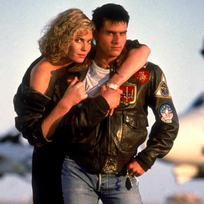 Kelly McGillis holding onto Tom Cruise