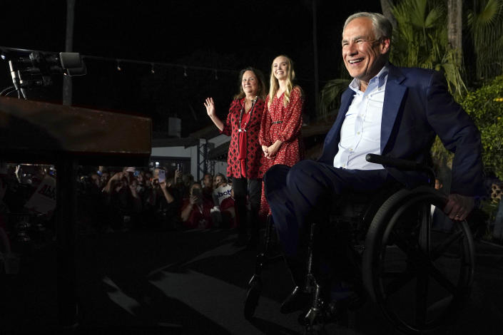 Texas Gov. Greg Abbott arrives to speaks during an election night campaign event Tuesday, Nov. 8, 2022, in McAllen, Texas, with his wife Cecilia Abbott and daughter Audrey. (AP Photo/David J. Phillip)