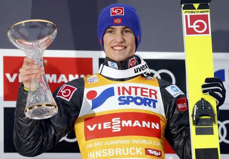 Ski Jumping - 65th four-hills ski jumping tournament first round - Innsbruck - 04/01/2017 - Norway's Daniel Andre Tande reacts on the winners podium. REUTERS/Dominic Ebenbichler