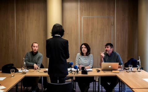 Grace, the wife of the missing Interpol president Meng Hongwey, talks to journalists on October 7. She did not want her face shown - Credit: JEFF PACHOUD/ AFP