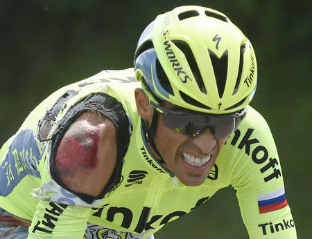 Injured Tinkoff team rider Alberto Contador of Spain reacts after a fall. REUTERS/Jerome Prevost/Pool