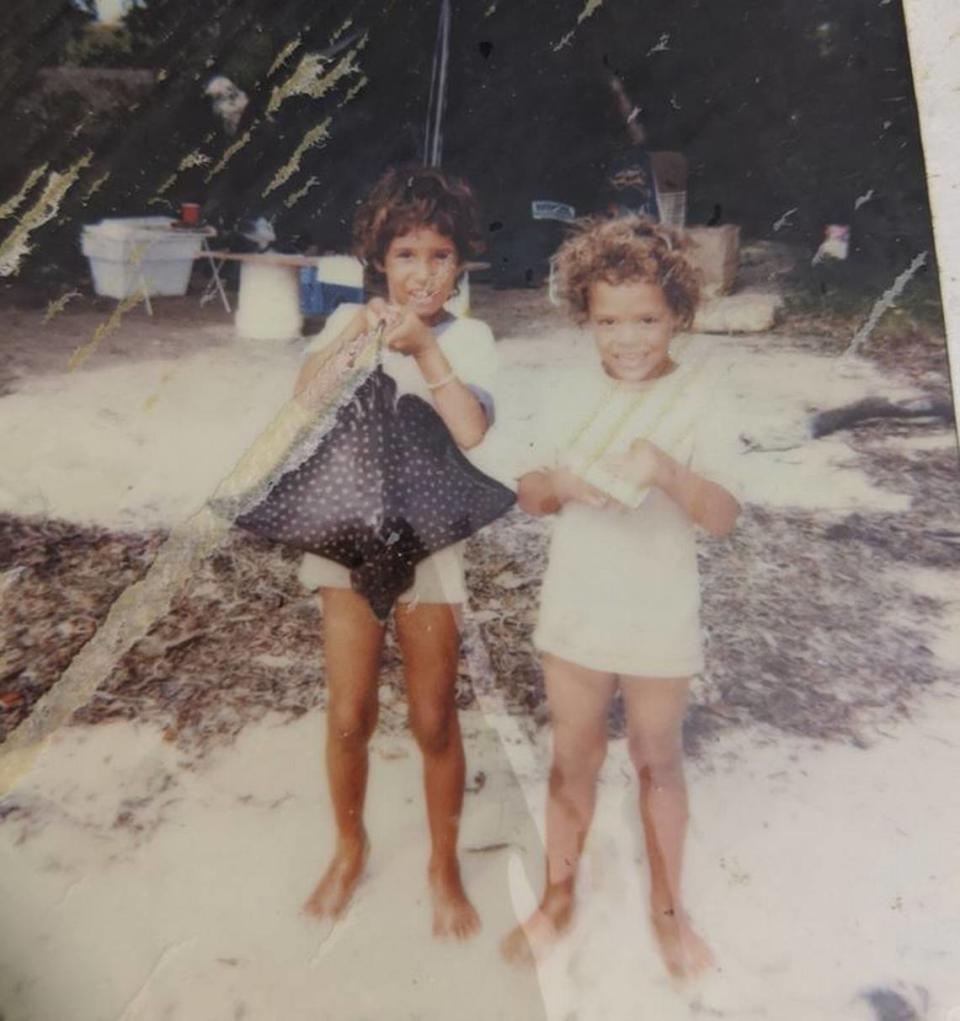 Gloria Hampton, right, and her older sister look at the camera at Anne’s Beach in Isla Morada, Florida, in the mid-80s.