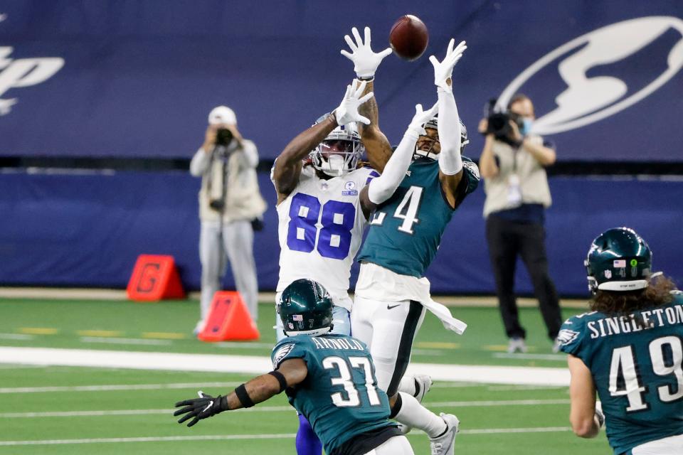 Philadelphia Eagles cornerback Darius Slay (24) and Dallas Cowboys wide receiver CeeDee Lamb (88) both go up for a pass which was intercepted by Slay in the second half of an NFL football game in Arlington, Texas, Sunday, Dec. 27. 2020. (AP Photo/Michael Ainsworth)