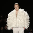 <b>Berlin Fashion Week</b>:This model walked the Leandro Cano show at Mercedes-Benz Fashion Week in Germany wearing an oversized cream fur cape.<br><br>Image © Rex