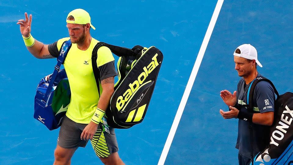 Sam Groth and Lleyton Hewitt leave the building. Pic: Getty