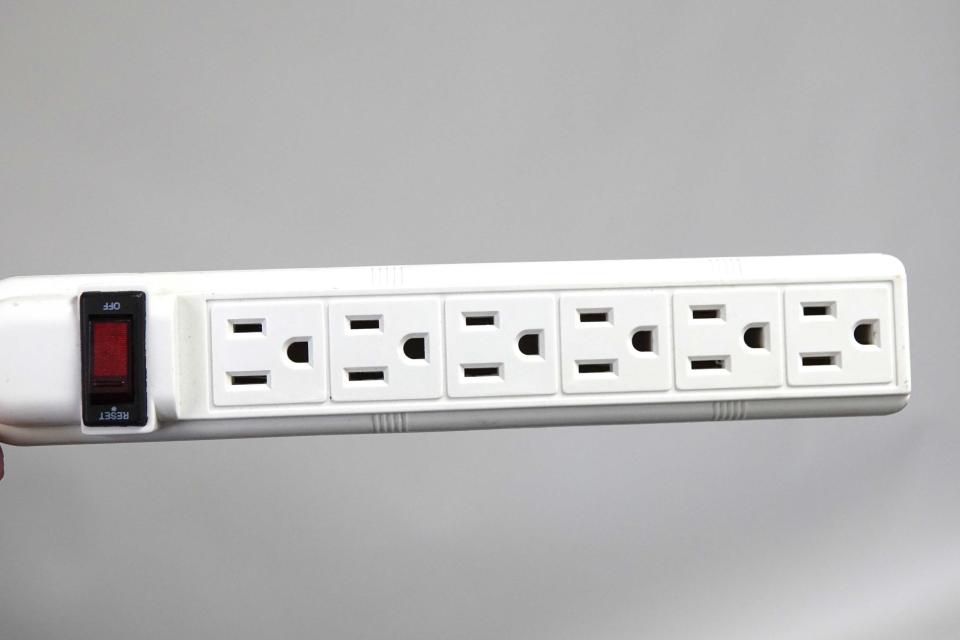 Bring a power strip to motels to find a place to plug in everyone's devices