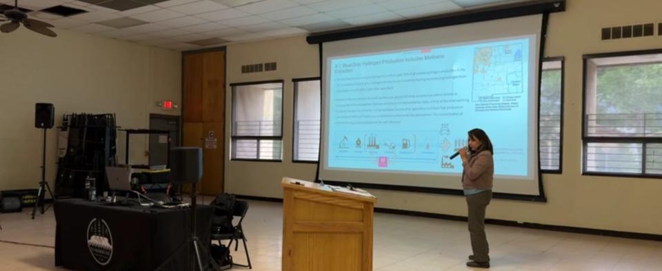 Jessica Keetso, a community organizer with Tó Nizhóní Ani, presents information during the Hydrogen Informational Summit in Shiprock on June 26. She discussed her research and presentation on a proposed hydrogen pipeline.