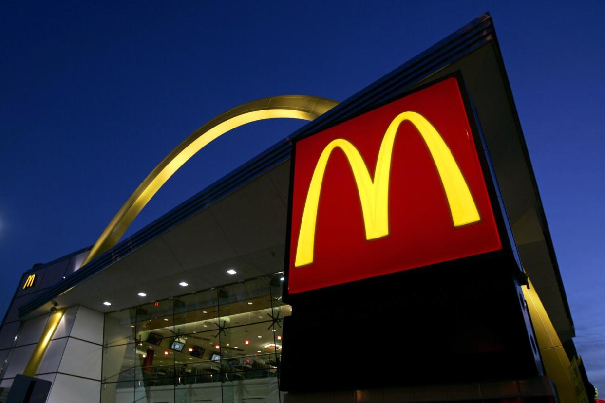 The exterior of a McDonald's branch at dusk.
