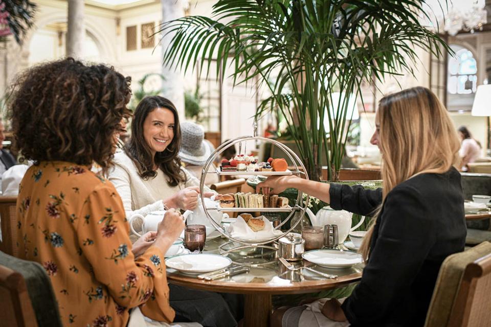 A group of women having afternoon tea at The Plaza