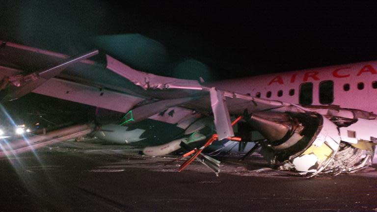 Handout photo by the Canada Transportation Safety Board shows wing damage to an Air Canada Airbus A-320 that skidded off the runway at Halifax International Airport in Halifax, Nova Scotia, March 29, 2015