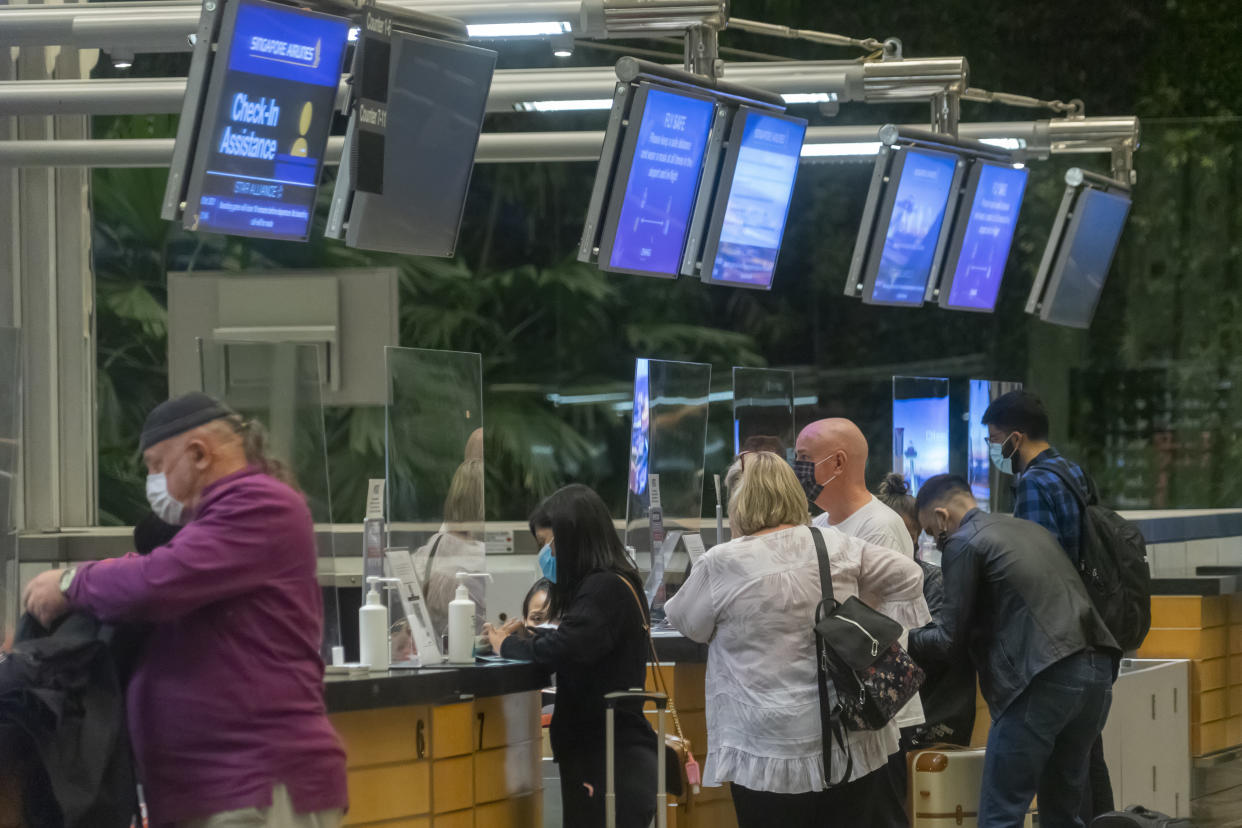 Omicron’s rapid spread shreds budding recovery in air travel. (PHOTO: Getty Creative)