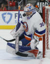 New York Islanders goaltender Ilya Sorokin (30) stops a shot during the first period of an NHL hockey game against the Detroit Red Wings, Saturday, Dec. 4, 2021, in Detroit. (AP Photo/Duane Burleson)