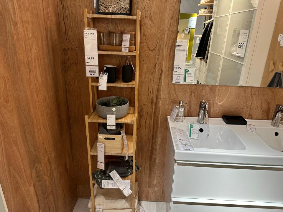 Bamboo-shelf organizers in a bathroom showroom at Ikea