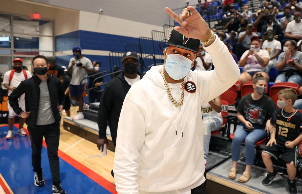 Allen Iverson waves to the crowd as he enters the gym during the Iverson Classic 24k Showcase at Bartlett High School on Friday, May 7, 2021. 