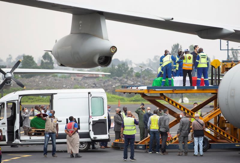 Officials load the bodies of the slain Italian ambassador to Democratic Republic of Congo Luca Attanasio and his Italian security Vittorio Iacovacci, at the Goma International Airport