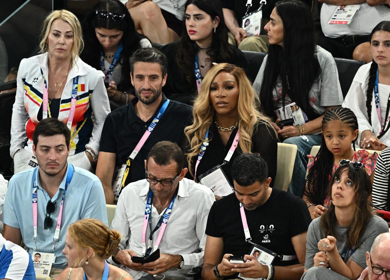 Serena Williams and her daughter Alexis Olympia are seen alongside former gymnast Nadia Comaneci, left, and Tony Estanguet, president of the Paris 2024 Organizing Committee, during the gymnastics women's team final on July 30, 2024.