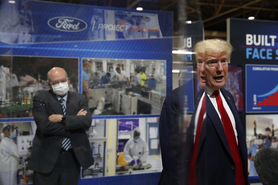 FILE - In this May 21, 2020, file photo, President Donald Trump speaks as he tours Ford's Rawsonville Components Plant that has been converted to making personal protection and medical equipment in Ypsilanti, Mich. The U.S. death toll from the coronavirus has eclipsed 400,000 in the waning hours in office for President Donald Trump. (AP Photo/Alex Brandon, File)