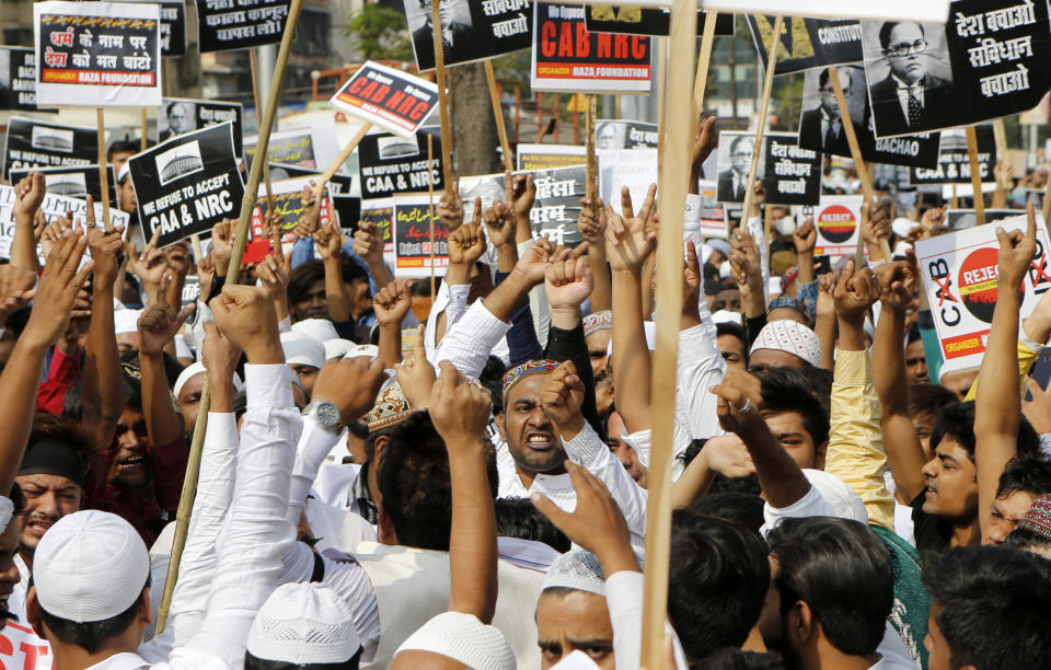 People participate in a protest rally against Citizen Amendment Act in Mumbai, India, Friday, Dec. 20, 2019. The protests have targeted the new citizenship law, which applies to Hindus, Christians and other religious minorities who are in India illegally but can demonstrate religious persecution in Muslim-majority Bangladesh, Pakistan and Afghanistan. It does not apply to Muslims. (AP Photo/Rajanish Kakade)