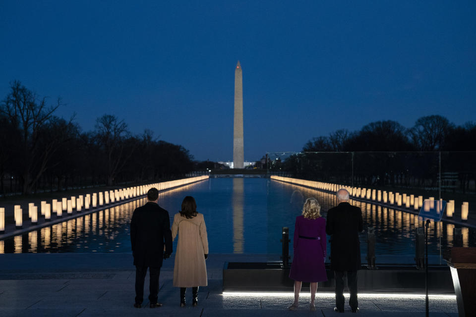 President-elect Joe Biden and his wife Jill Biden are joined by Vice President-elect Kamala Harris and her husband Doug Emhoff during a COVID-19 memorial event at the Lincoln Memorial Reflecting Pool, Tuesday, Jan. 19, 2021, in Washington. (AP Photo/Evan Vucci)