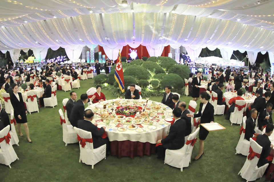 This photo provided by the North Korean government shows North Korean leader Kim Jong Un, center, and his wife Ri Sol Ju, center left, attend a celebration marking the nation's anniversary, at the parliament in Pyongyang, North Korea, Sept. 8, 2022. Independent journalists were not given access to cover the event depicted in this image distributed by the North Korean government. The content of this image is as provided and cannot be independently verified.(Korean Central News Agency/Korea News Service via AP)