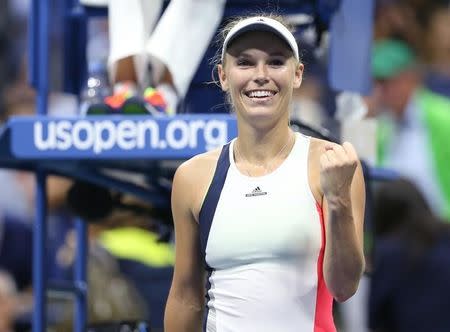 Caroline Wozniacki of Denmark celebrates after recording match point against Anastasija Sevastova of Latvia on day nine of the 2016 U.S. Open tennis tournament at USTA Billie Jean King National Tennis Center. Jerry Lai-USA TODAY Sports