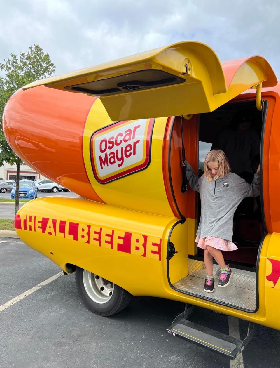 A girl steps off the Oscar Mayer Frankmobile on Wednesday during its tour of Northeast Ohio. The unique vehicle will be in downtown Canton on Friday.