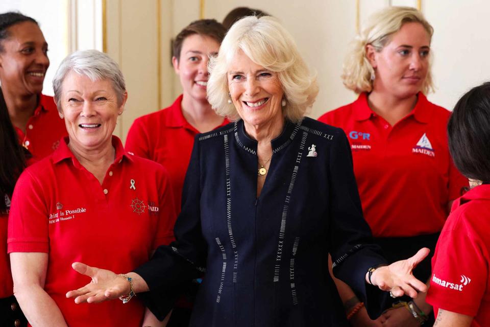 <p>CHRIS JACKSON/POOL/AFP via Getty</p> Queen Camilla hosts the Maiden yachting crew at Clarence House in London on April 29, 2024.