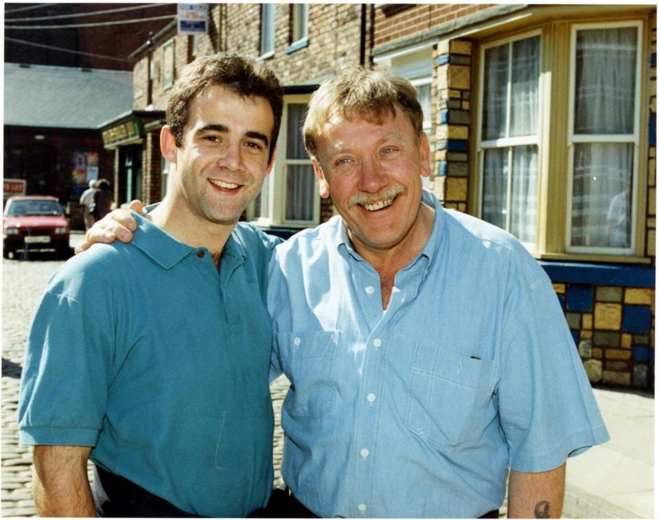 Happy family: Armitage with his onscreen son Kevin Webster played by Michael Le Vell