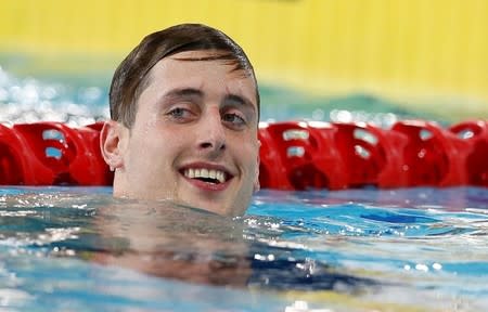 England's Chris Walker-Hebborn reacts after winning the Men's 100m Backstroke Final at the 2014 Commonwealth Games in Glasgow, Scotland, July 25, 2014. REUTERS/Suzanne Plunkett