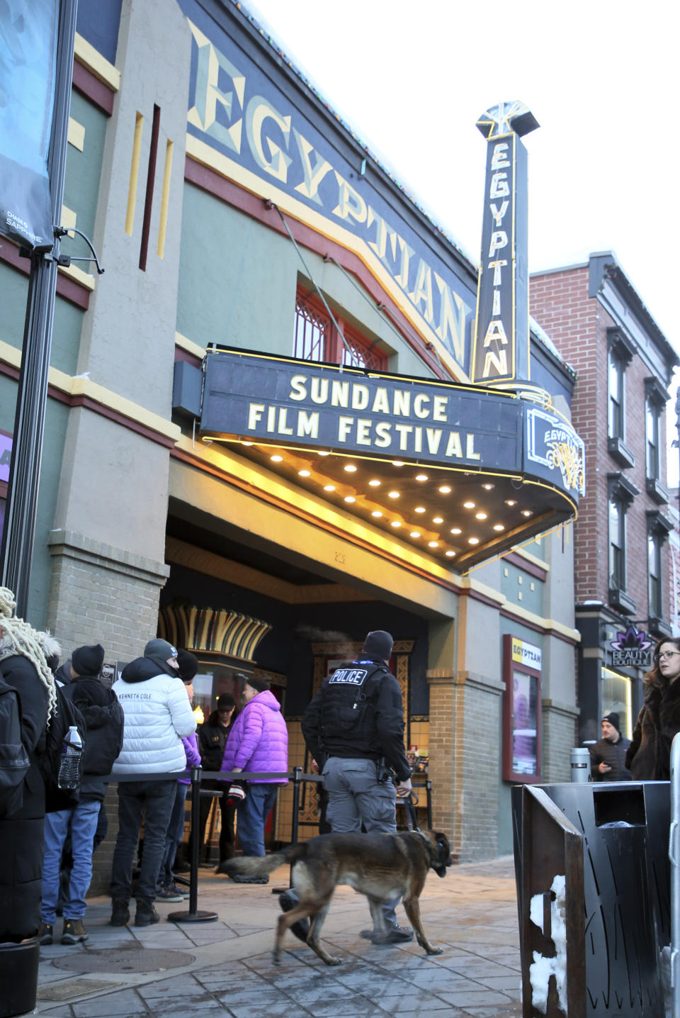 A K-9 police unit walks in front of the Egyptian Theatre on Main Street before the premiere of the "Leaving Neverland" Michael Jackson documentary film during the 2019 Sundance Film Festival, Friday, Jan. 25, 2019, in Park City, Utah. (Photo by Danny Moloshok/Invision/AP)