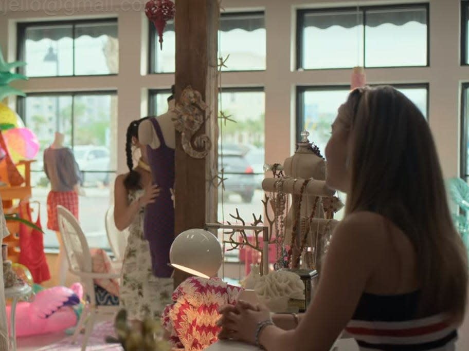 auden and the girls standing in clementine's boutique in along for the ride