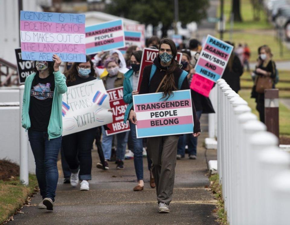 Protestors in support of transgender rights march around the Alabama State House in Montgomery, Ala., on Tuesday, March 2, 2021. / Credit: Jake Crandall/The Montgomery Advertiser via AP