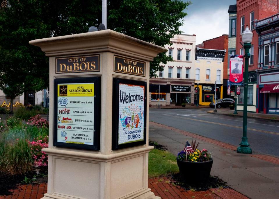 A sign and street in downtown DuBois.