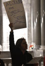 Members of the Kentucky Teachers Association gather at the Kentucky state Capitol to protest the special session that was called by Kentucky Gov. Matt Bevin in Frankfort, Ky., Monday, Dec. 17, 2018. The session was called to address funding for the state workers pension fund. Teachers rejoiced and Republicans despaired across Kentucky on Thursday as the state's Supreme Court struck down a law that had made changes to one of the country's worst-funded pension systems. (AP Photo/Timothy D. Easley)